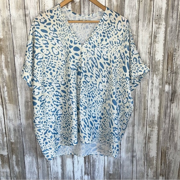 JODIFL Tops - Jodifl Cream & Blue Animal Print Oversized Whimsy Blouse
